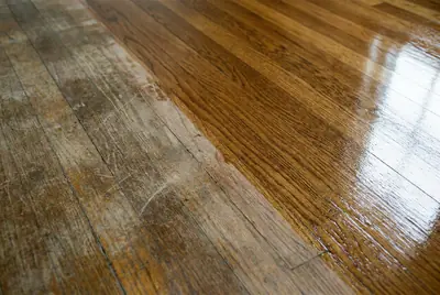 The same hardwood boards before and after a sandless refresh